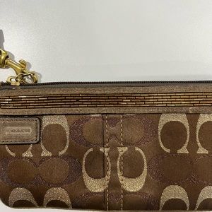 Women’s Brown and Gold Coach Wristlet